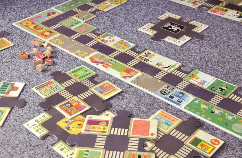Riesenpuzzle – Straße mit Verkehrszeichen