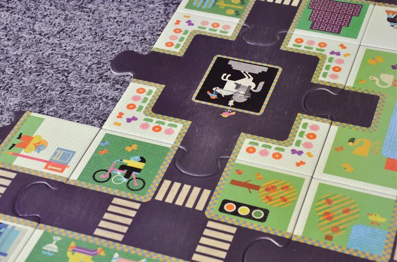 Riesenpuzzle – Straße mit Verkehrszeichen