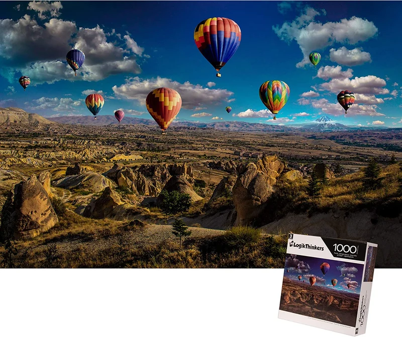 Hot Air Balloons over Brown Mountain Range